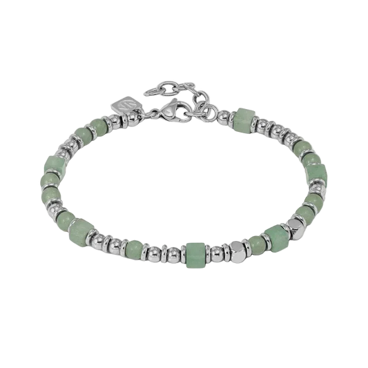 Bracelet with green beads and silver accents on a light gray background