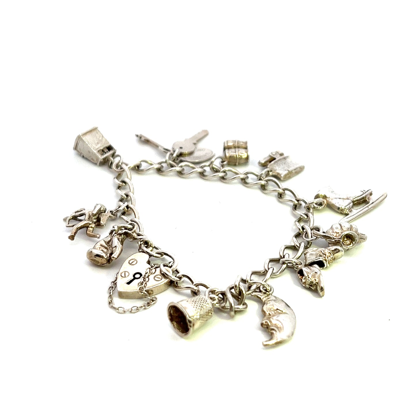 Pre Owned Silver Bracelet With Eleven Assorted Charms