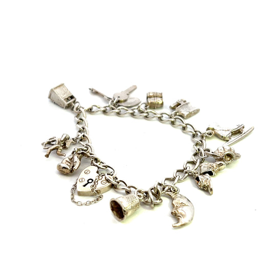 Pre-Owned Silver Bracelet With Eleven Assorted Charms