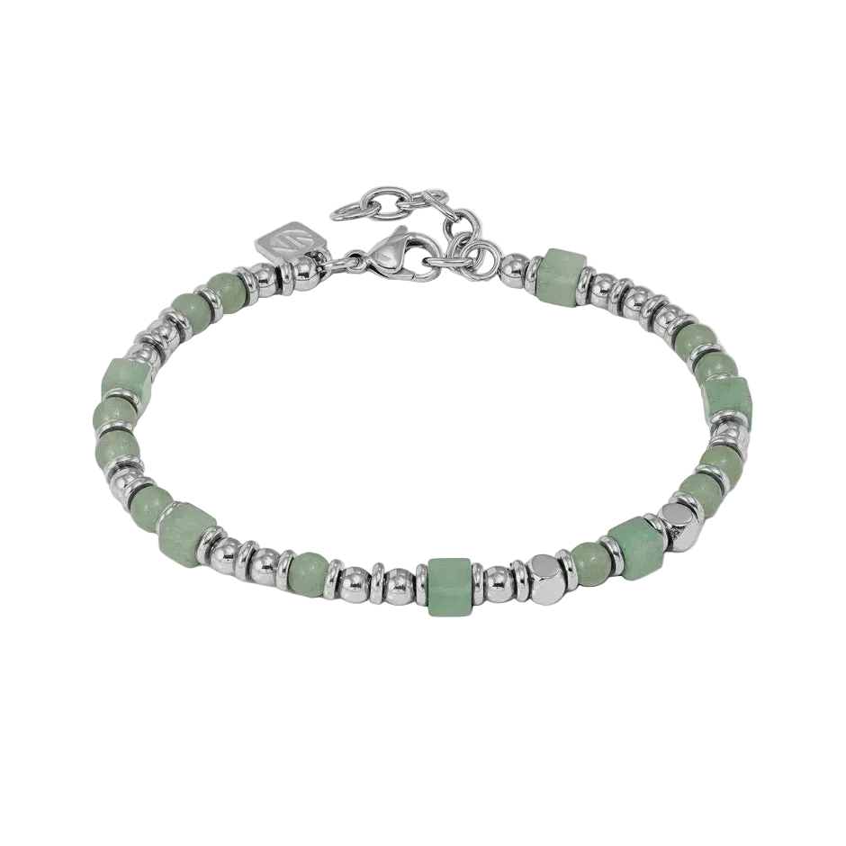 Bracelet with green beads and silver accents on a light gray background