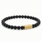 Steel & Barnett 6mm Onyx Beads Stretch Yellow Gold Plated Stainless Steel Bracelet Small
