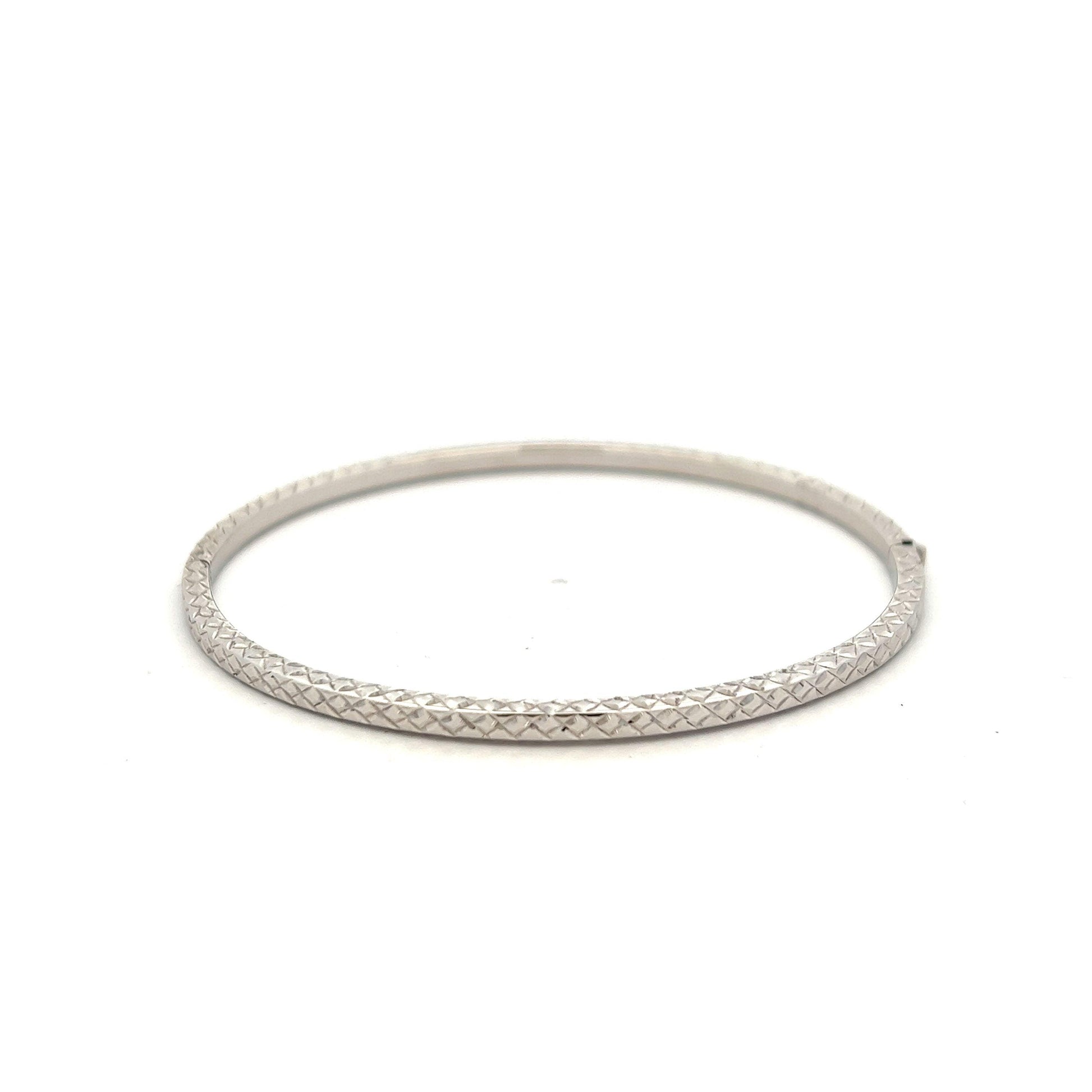 9ct White Gold Diamond Cut Hollow Bangle - Judith Hart Jewellers